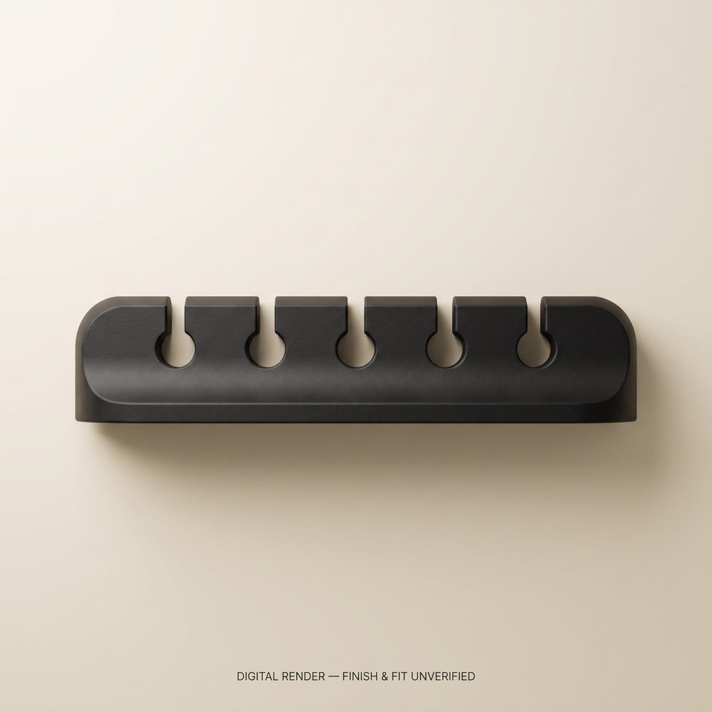 AI-assisted digital render of the cable organizer, overhead view. Illustrative black finish; not a product photograph. Production finish and fit unverified.