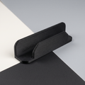AI-assisted studio illustration of the slim remote-control dock in black PETG. Product only; remote and mounting supplies are not included.