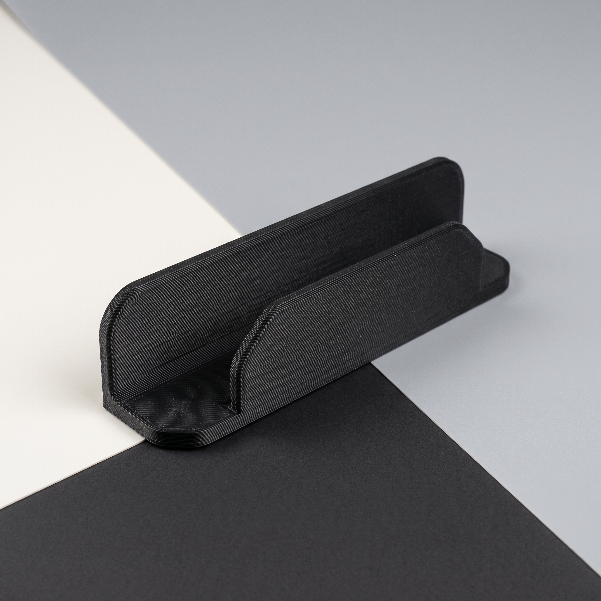 AI-assisted studio illustration of the slim remote-control dock in black PETG. Product only; remote and mounting supplies are not included.